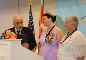 Rainbow girl receiving Grill Scholarship at Grand Assembly